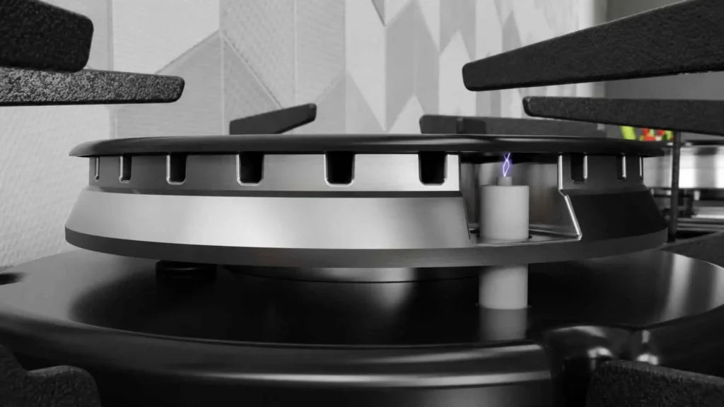 Detalhe do queimador de alumínio e trempe de aço com 6 pontos de apoio do cooktop Itatiaia Electra