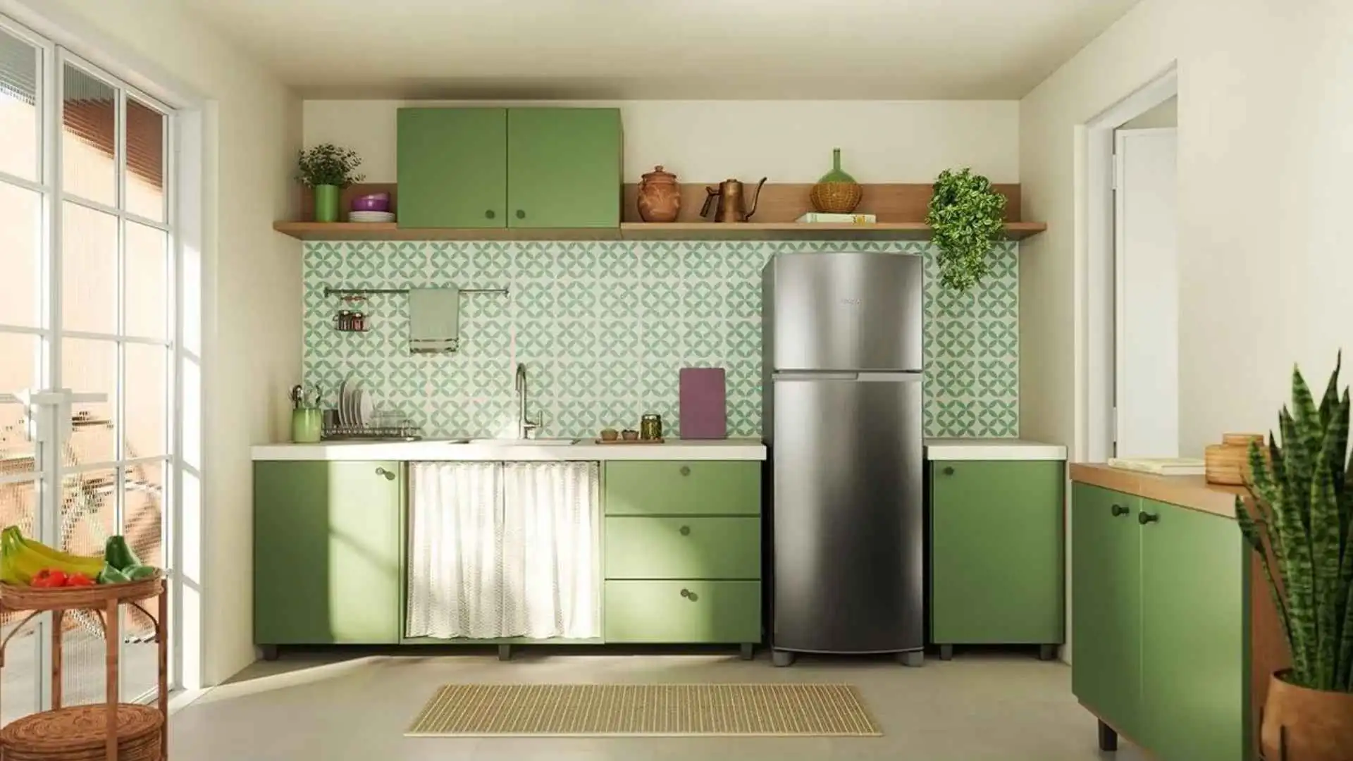 Geladeira Consul Frost Free Duplex CRM40MK em inox posicionada em uma cozinha moderna com armários verdes